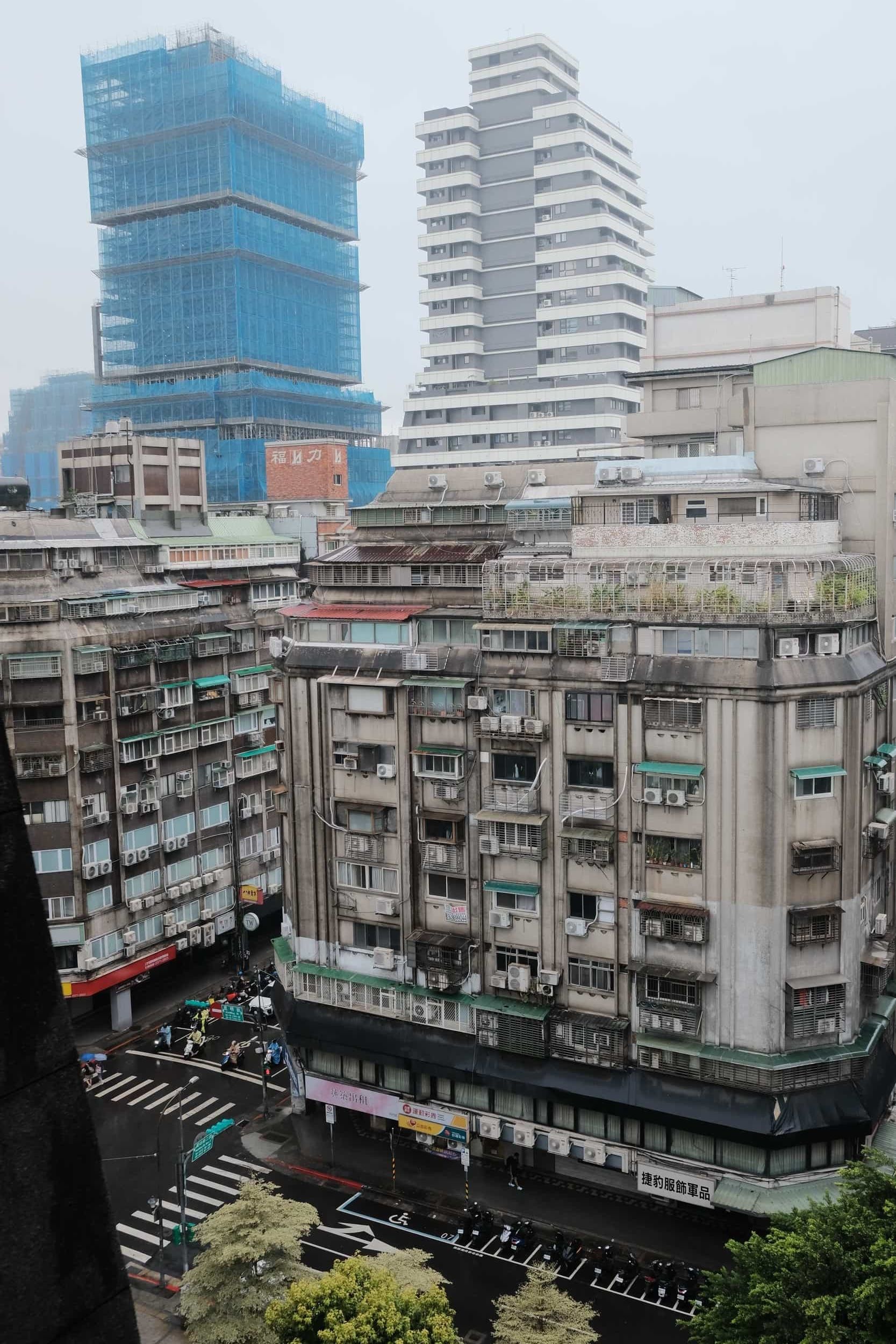 View from a window in Taipei with skyscrapers in the background, scene from Ximen